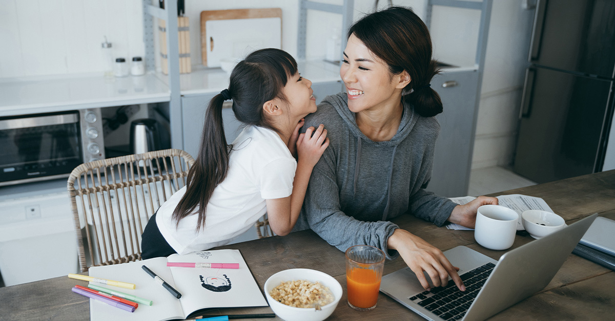 A young mother takes a break from work to enjoy time with her daughter